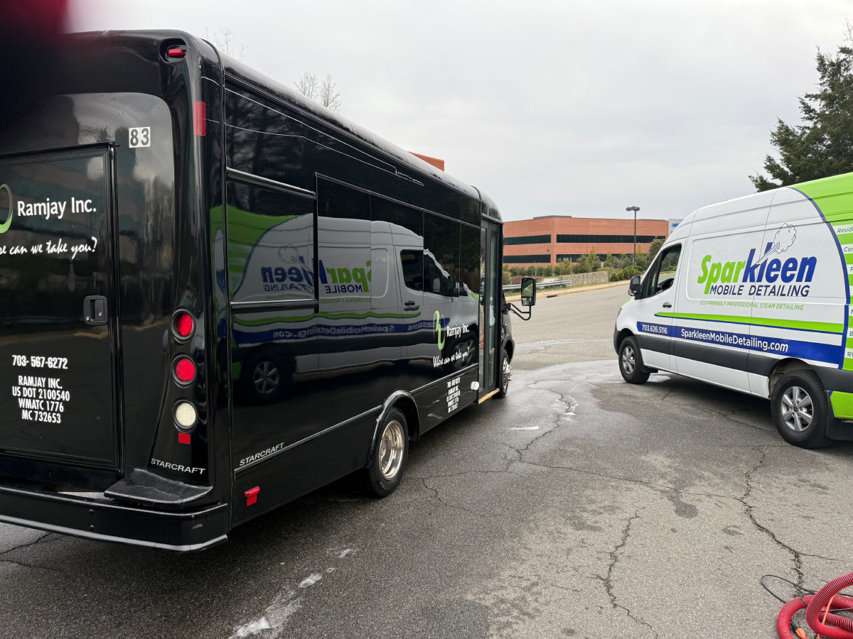 Sparkleen mobile detailing vehicles parked on pavement